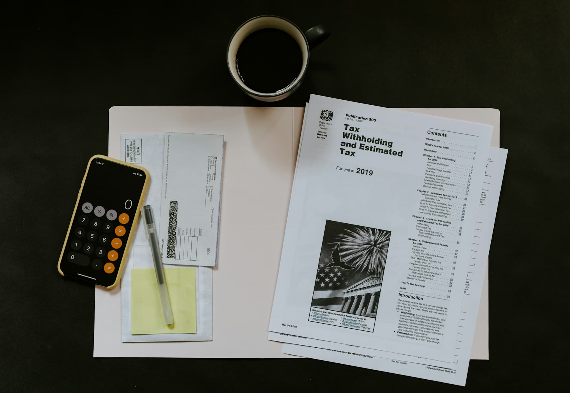 Tax documents and calculator for individual tax preparation.
